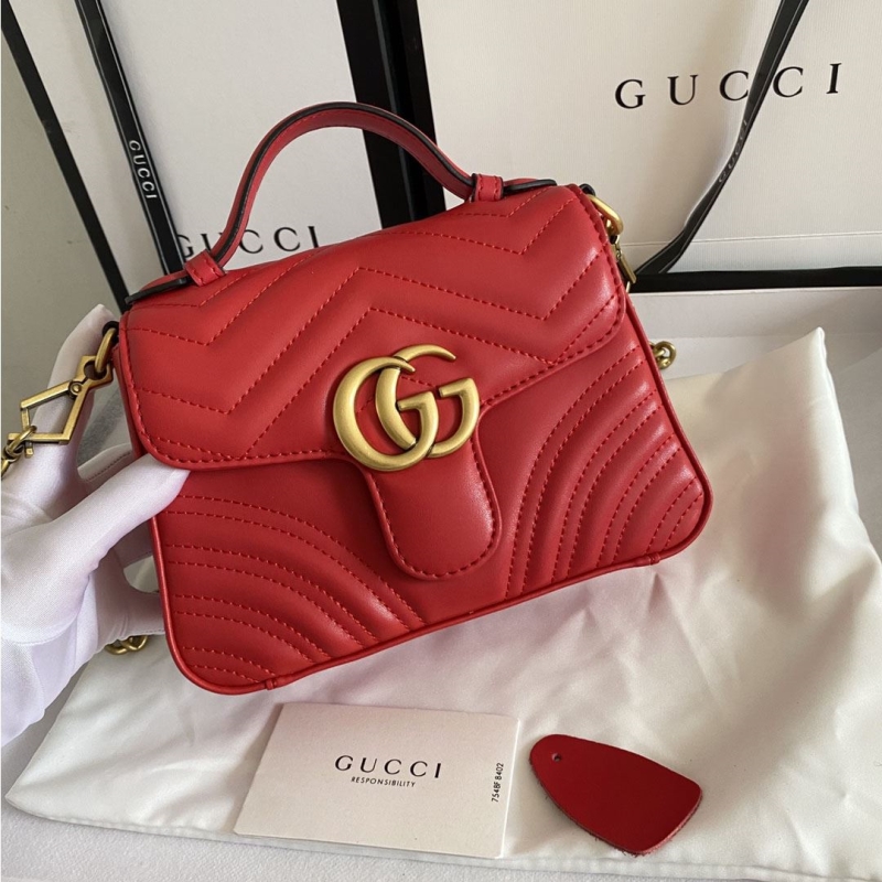 G*u*i top handle bags